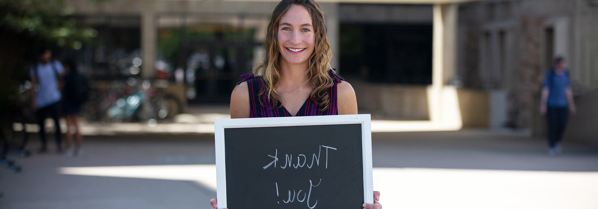 Smiling student saying thank you