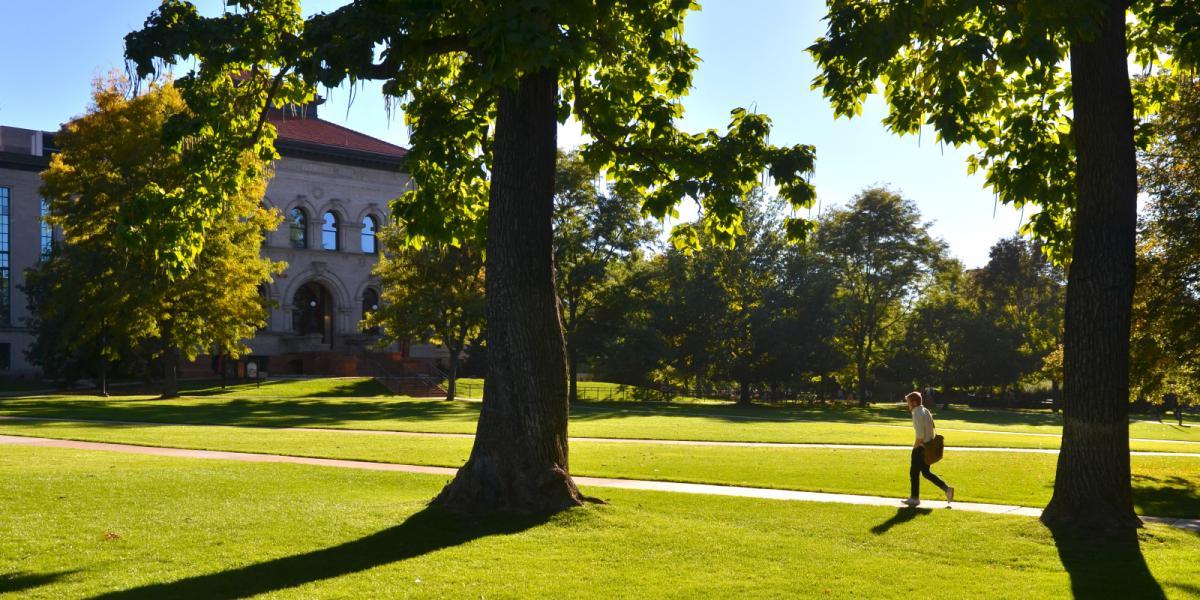 person walking on Norlin Quad