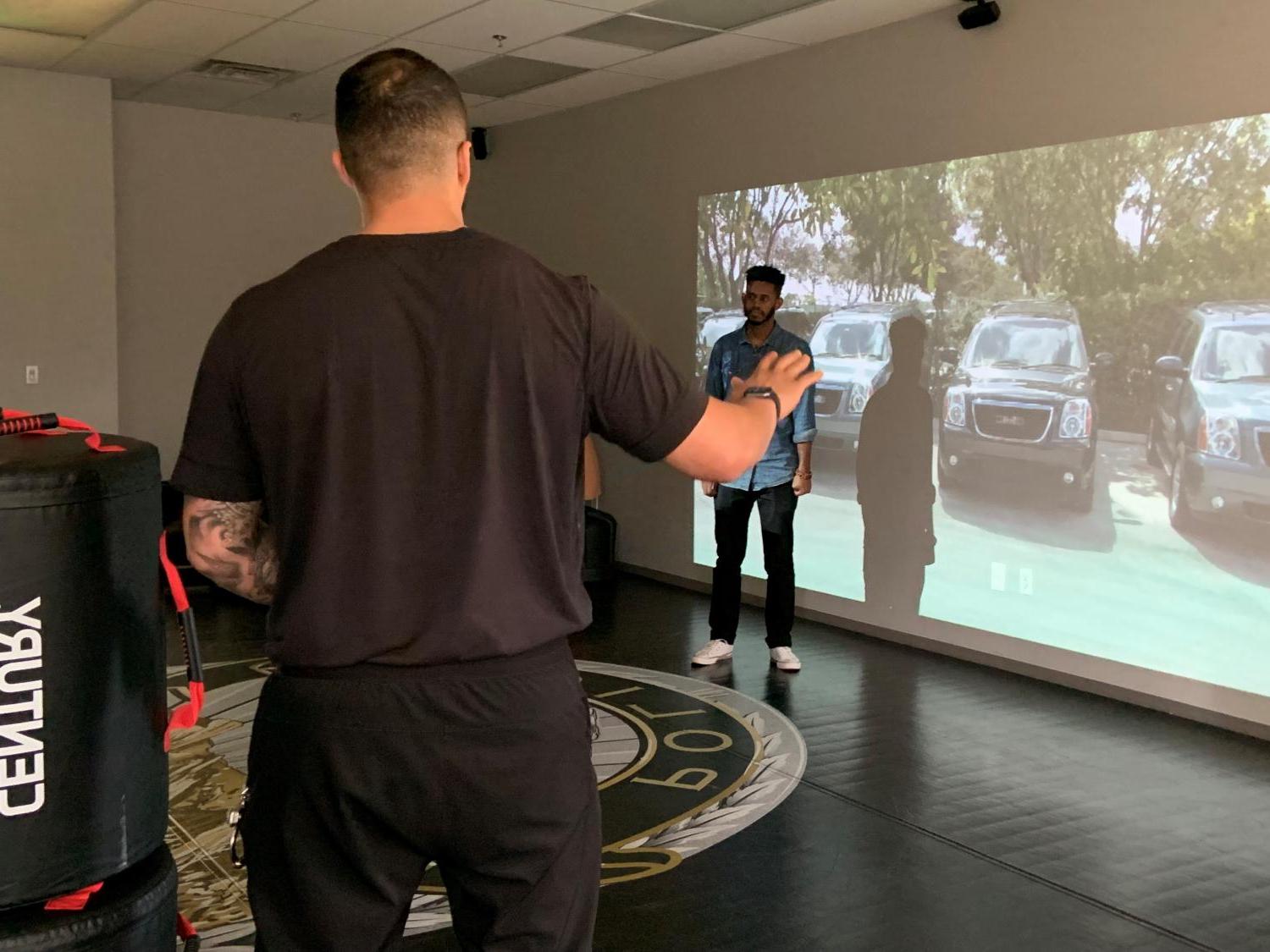 CUPD officer in scenario-based communication training