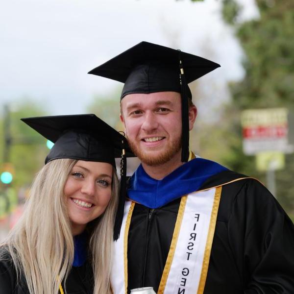 Students posing after graduation