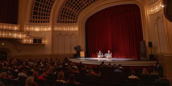 Person speaking in Macky Auditorium