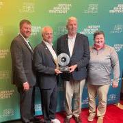 Angie Gilbert, Dave Newport, Jamie Zaninovich and Jason Depaepe receiving an award