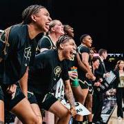 Members of the 2023 Buff Women’s Basketball Team cheer from the sideline