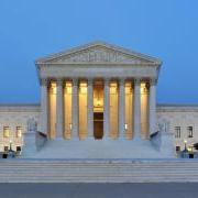 The United States Supreme Court building at dusk. 