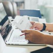 Person looking at a printed resume