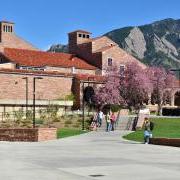 campus community members walking outside of the UMC on a spring day