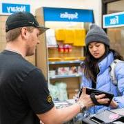 Student working in the campus UPS store